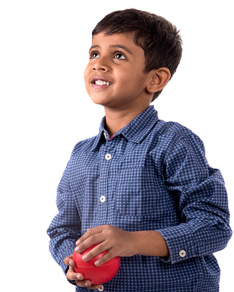 Smiling child holding a red ball